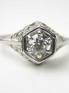 an vintage engagement ring with a scroll design vintage engagement ring , embodies the sophistication of this remarkable era.