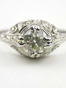 Vintage Filigree Engagement Ring in Platinum - Topazery... In a world of mass-produced jewelry, there's a unique and enduring charm to a piece that tells a story.