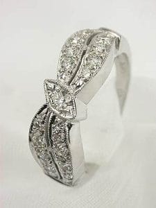 The Topazery Vintage Collection Wedding Ring, Item #rg2484, is more than just an adornment; it's a bridge to a bygone era,